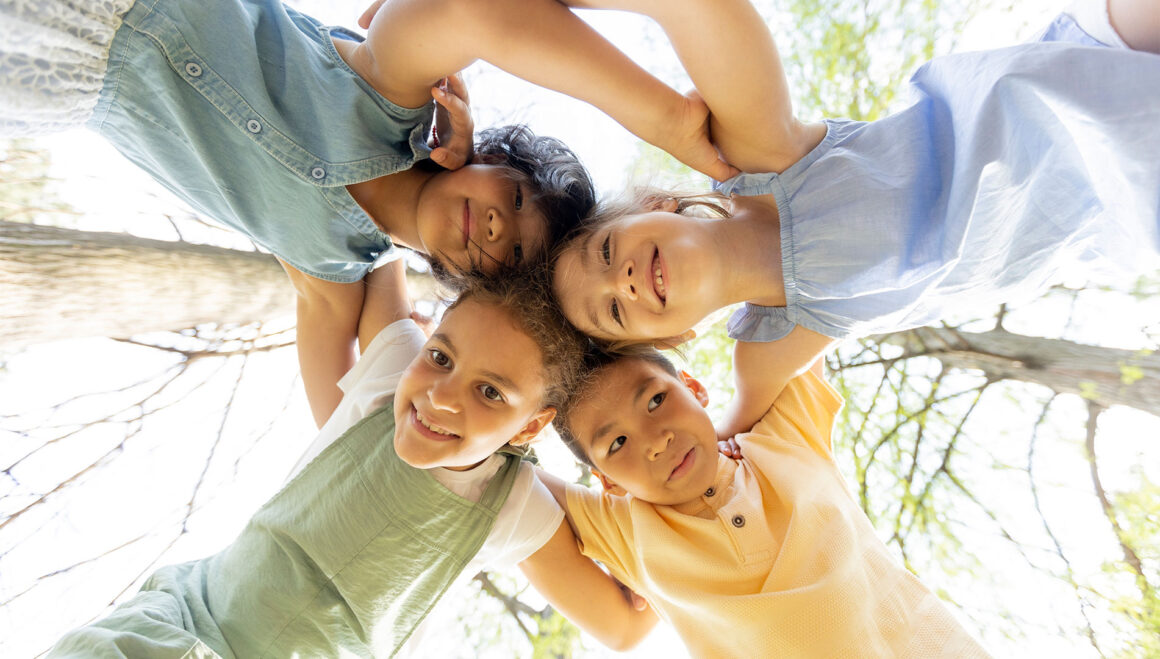 group-of-asian-and-caucasian-happy-kids-huddling-2022-07-26-02-37-08-utc Never Be Alone Again
